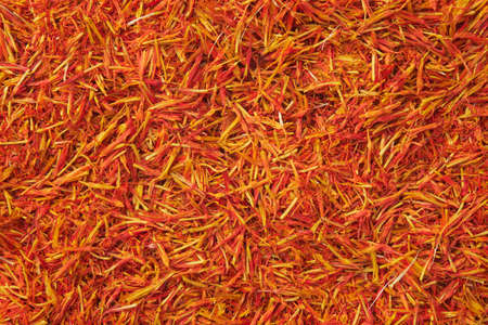 Saffron seasoning background. Organic Saffron or alternative to saffron - Safflower spice texture closeup.の写真素材