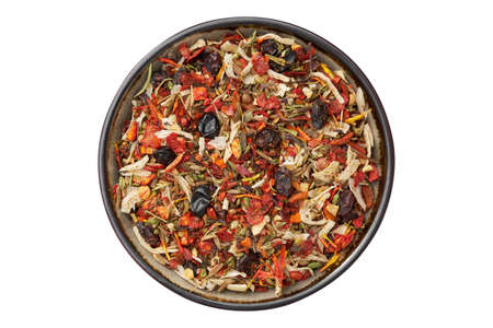 Bowl of spice mix for cooking oriental asian dishes - plov, curry and others. Flakes of parsley, celery roots, tomatoes, red hot pepper, paprika, onion, barberry berries, cumin, saffron seasoning.の写真素材