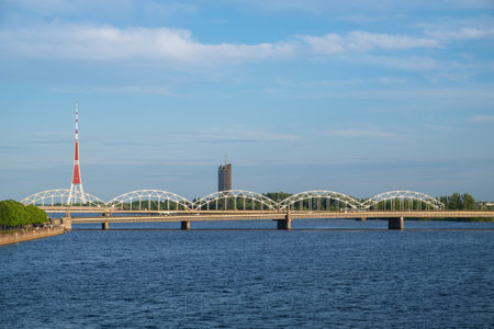 View of the railway bridge over Daugava river and Riga Radio and Television Tower. Riga, Latvia.の写真素材