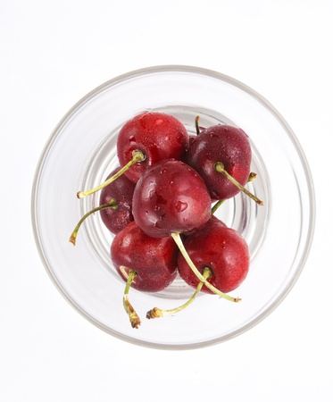 Red cherry in a glass on a white background の写真素材