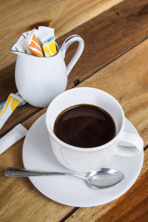 Black coffee on a wooden background の写真素材