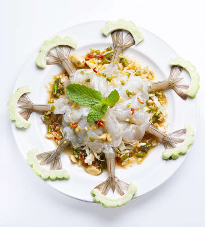 Raw Shrimp with chili sauce on white background の写真素材