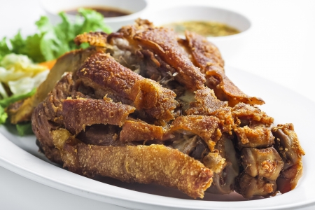 Fried pork hocks with preserve and sauce on white background の写真素材