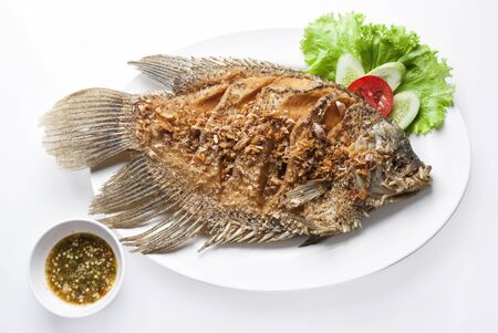 Fried Giant Gourami fish with garlic and pepper の写真素材