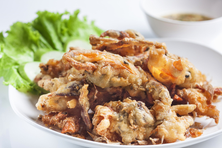Batter-fried soft shell crab on white background の写真素材