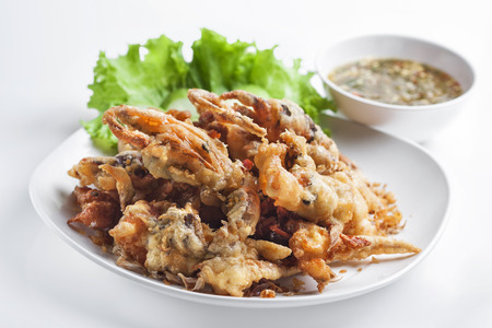 Batter-fried soft shell crab on white background の写真素材
