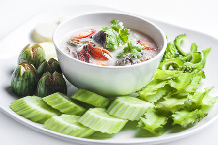 Thai styled Chili sauce and vegetables on white background の写真素材