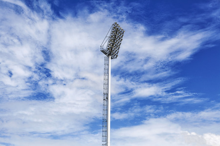 Stadium of light and cloudy blue sky background の写真素材