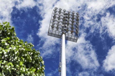 Stadium of light and cloudy blue sky background の写真素材