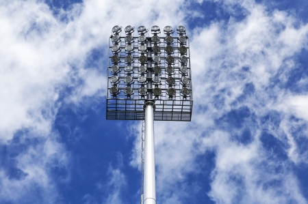 Stadium of light and cloudy blue sky background の写真素材