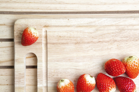 Strawberry on chopping wood ,leafless  の写真素材