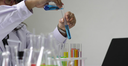 scientist working in the chemistry laboratory / researcher working in the lab analyzing.