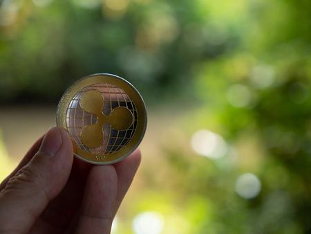 ripple coin and copyspace blur background. money online investment  cryptocurrency concept....