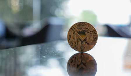 m coin on table with bokeh copyspace. cryptocurrency concept.の写真素材