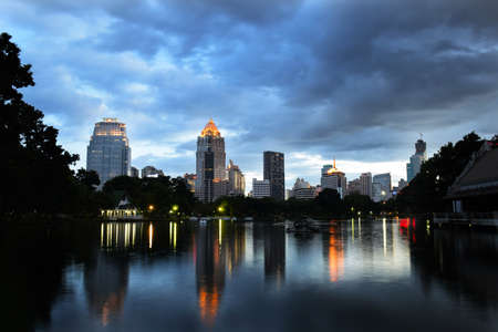 Cityscape building from park in the evening at Bangkok, Thailand (background)の写真素材
