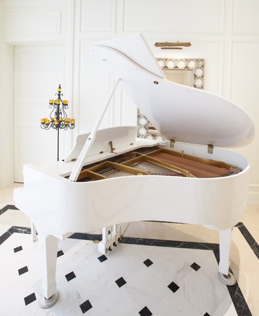 White piano in white roomの写真素材