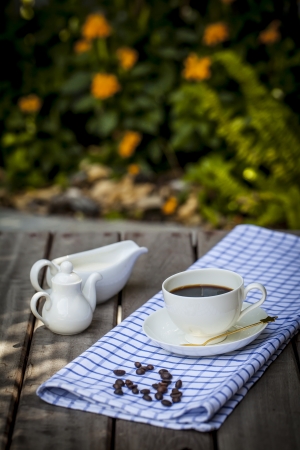 Coffee cup on grunge wood floorの写真素材