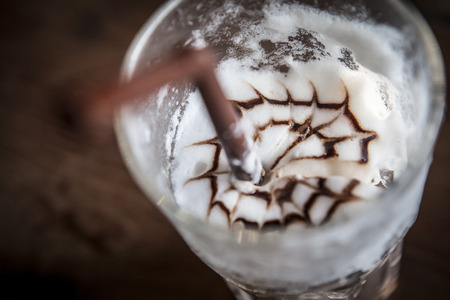 Iced coffee with cream toppingの写真素材