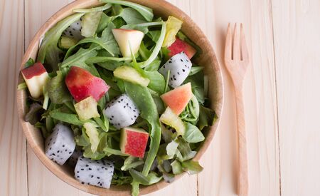 Fresh healthy salad on wooden tableの写真素材