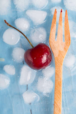 fresh cherries on wooden tableの写真素材