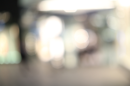 blurred image of shopping mall and people