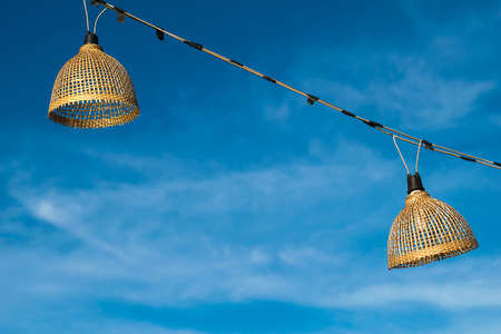 bamboo lamp with sky background at thasadej market nongkhai thailandの写真素材