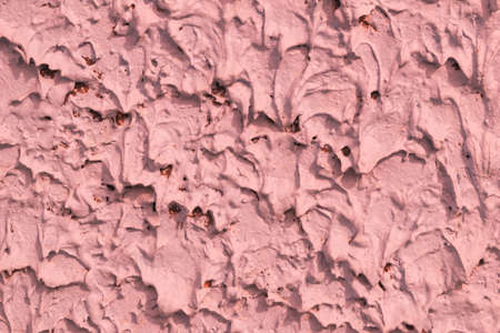 close up crude pink concrete grunge texture backgroundの写真素材