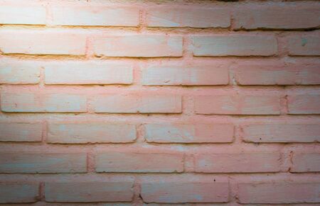 brick wall background  with light from cornerの写真素材