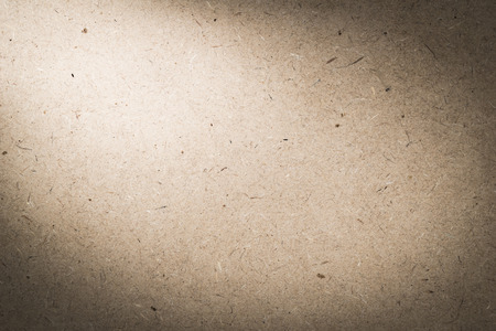 plywood hardboard background with light from cornerの写真素材