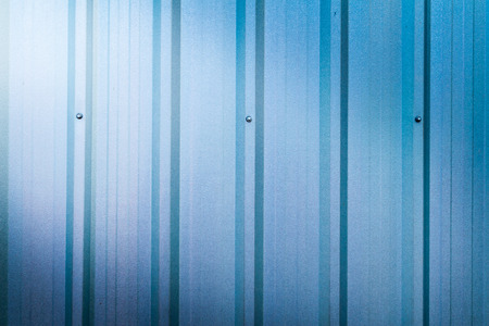 beautiful blue zinc wall background with light from cornerの写真素材