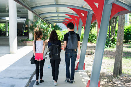 Young Students Group Waliking with School Folder to Education Campus Universityの写真素材