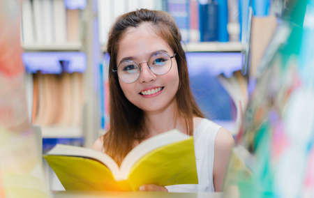 Close up Young Girl Students with School Folders Book in Education Campus University libraryの写真素材