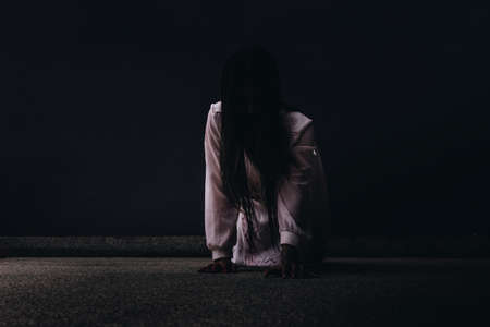 Zombie women death ghost with blood, darkness background, horror halloween festival conceptの写真素材