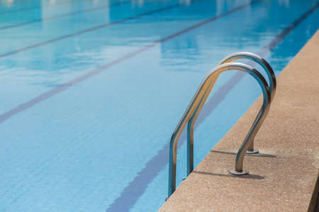 Pool ladder step of a swimming pool.の写真素材
