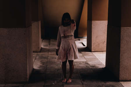 Zombie women death characters the ghost standing in old ruin house with hand blood skin is screaming darkness and nightmare  horror on hell is monster devil girl in halloween festival conceptの写真素材