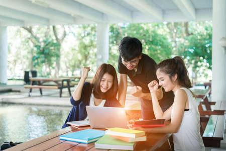 Young Students Group Consult with School Folders,Laptop Computer in Education Campus Universityの写真素材