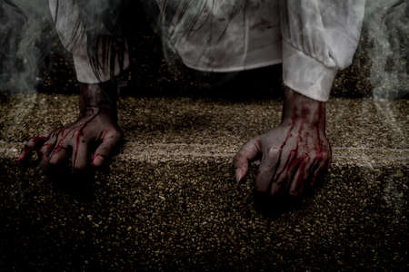 Zombie women death characters the ghost standing in old ruin house with hand blood skin is screaming darkness and nightmare  horror on hell is monster devil girl in halloween festival conceptの写真素材