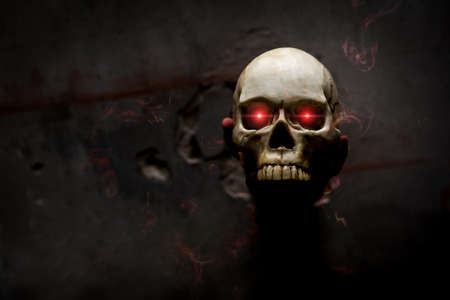 Hand death the ghost holding skull bone skeleton with Flame blood is screaming darkness and nightmare, horror of scary fear on hell is monster devil in halloween festival,copy space の写真素材