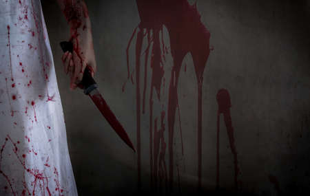 Closeup Ghost woman holding knife for kill with blood violence in house of ruin, nightmare, horror...