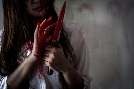 Ghost woman or zombie hold knife for kill with blood violence in house of ruin, nightmare, horror of...