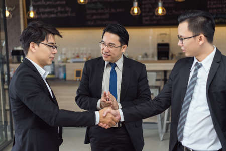 Businessmen meeting group handshake partner teamwork together consult for successful project completeの写真素材