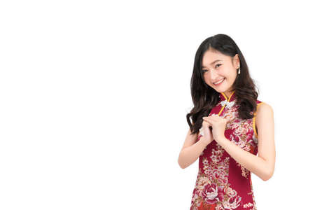 Asian woman wearing chinese dress congratulation or cheongsam,qipao smile in chinese new year on...