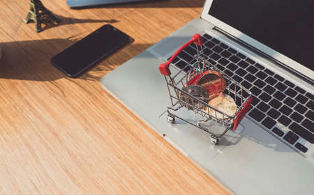 Bitcoin shopping card digital money concept, Electronic exchange market global network on laptop computer and smartphone working place table officeの写真素材