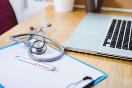 Stethoscope medicine with laptop computer doctor and hospital heath care workplace conceptの写真素材