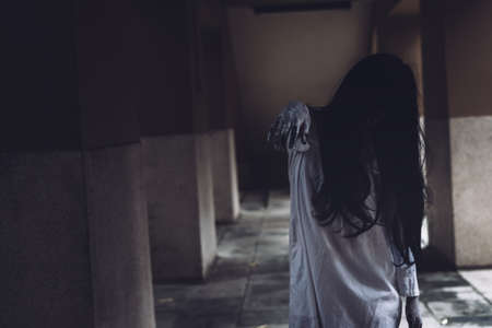 Horror scene of ghost woman death movie halloween festival in the dark house nightmare screaming on...