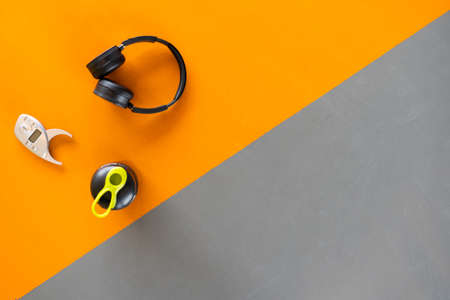 Exercise workout equipment at gym fitness training sport headphone,apple fruit, protein shake, digital caliper healthy lifestyle relax bodybuilding on top view copy space the right.の写真素材