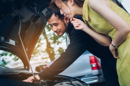 Man check and repairing problem car of woman when accident his have insurance.