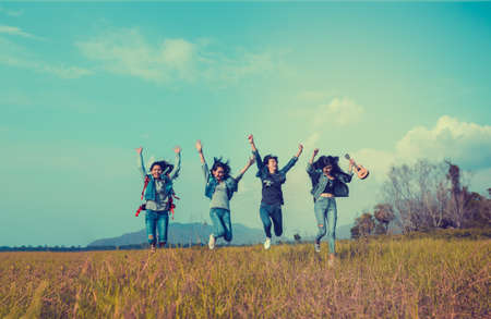 Group of Young Asian women jumping enjoy travel trekking to destination in vacation time for go to...