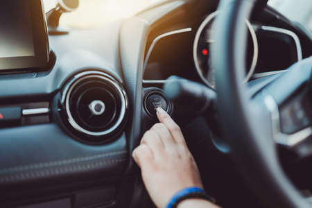 Push start,stop button engine car control of finger woman before driving after press the brake.の写真素材