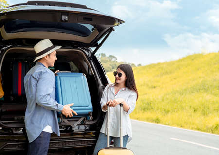Happy couple asian family with car travel driving and suitcase at mountain road and street in vacation summer road trip on holidays to destination, Traveler transportation vehicle people lifestyle の写真素材